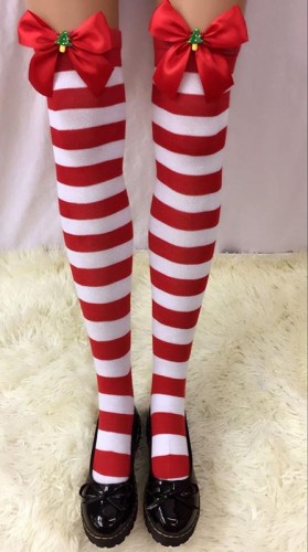 Striped Stockings With Black Bows and Christmas Tree