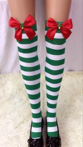 Striped Stockings With Black Bows and Christmas Tree