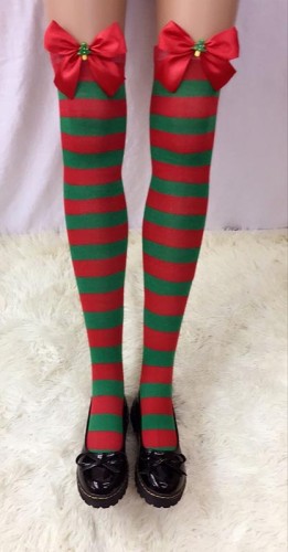 Striped Stockings With Red Bows and Christmas Tree