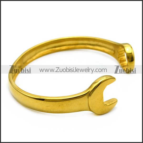 yellow gold plated stainless steel casting spanner bangle b007006