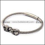 silver stainless steel two skulls wire bangle b007543