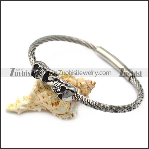 silver stainless steel two skulls wire bangle b007543