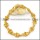 11 small skull heads bracelet in gold tone b002342