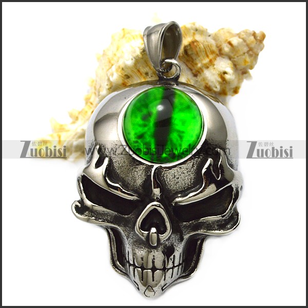 skull pendant with big green stone
